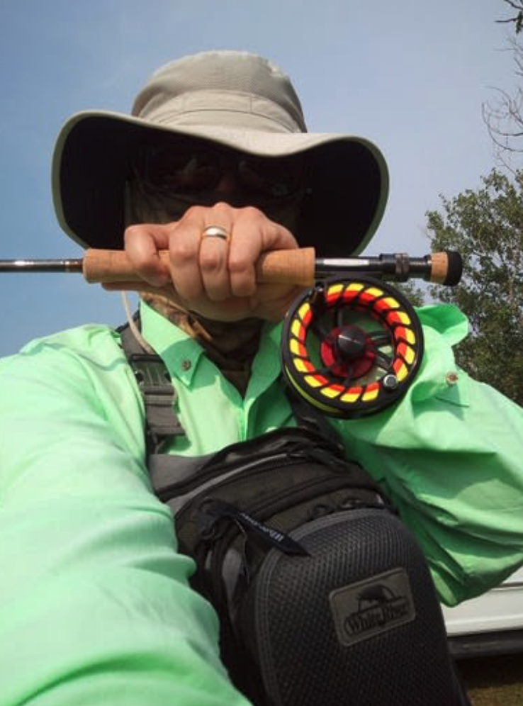Zach sporting a fishing Buff